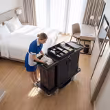 Commercial Housekeeping Trolley - with lockable doors - 2 laundry bags, 1 top shelf with compartments, 1 bottom shelf - Polypropylene (PP) frame - Black