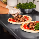 Tavolo da lavoro in acciaio inox ECO - 1000x600mm - con ripiano inferiore & alzatina